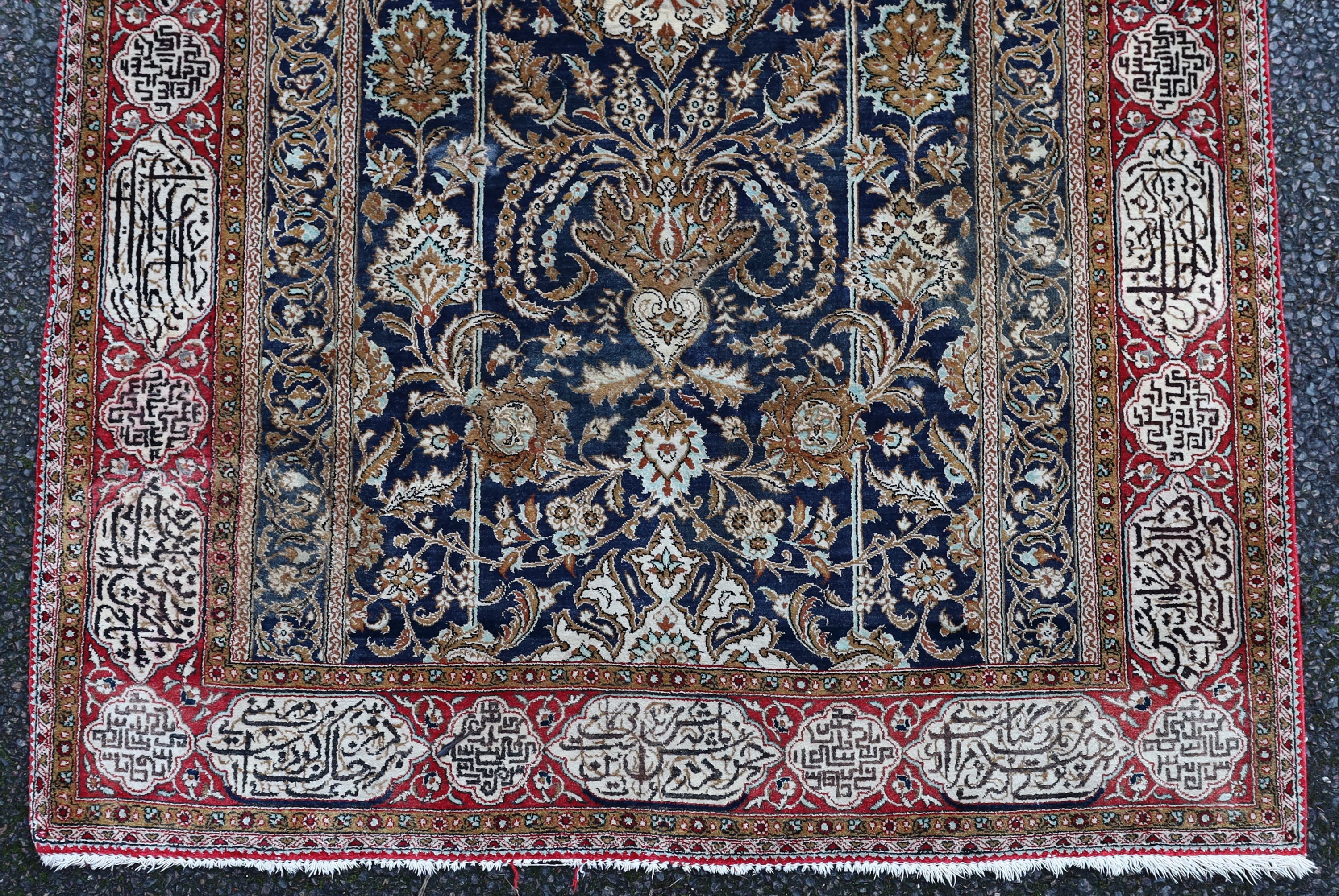An early 20th century Kashan silk blue ground prayer rug, 162 x 109cm.